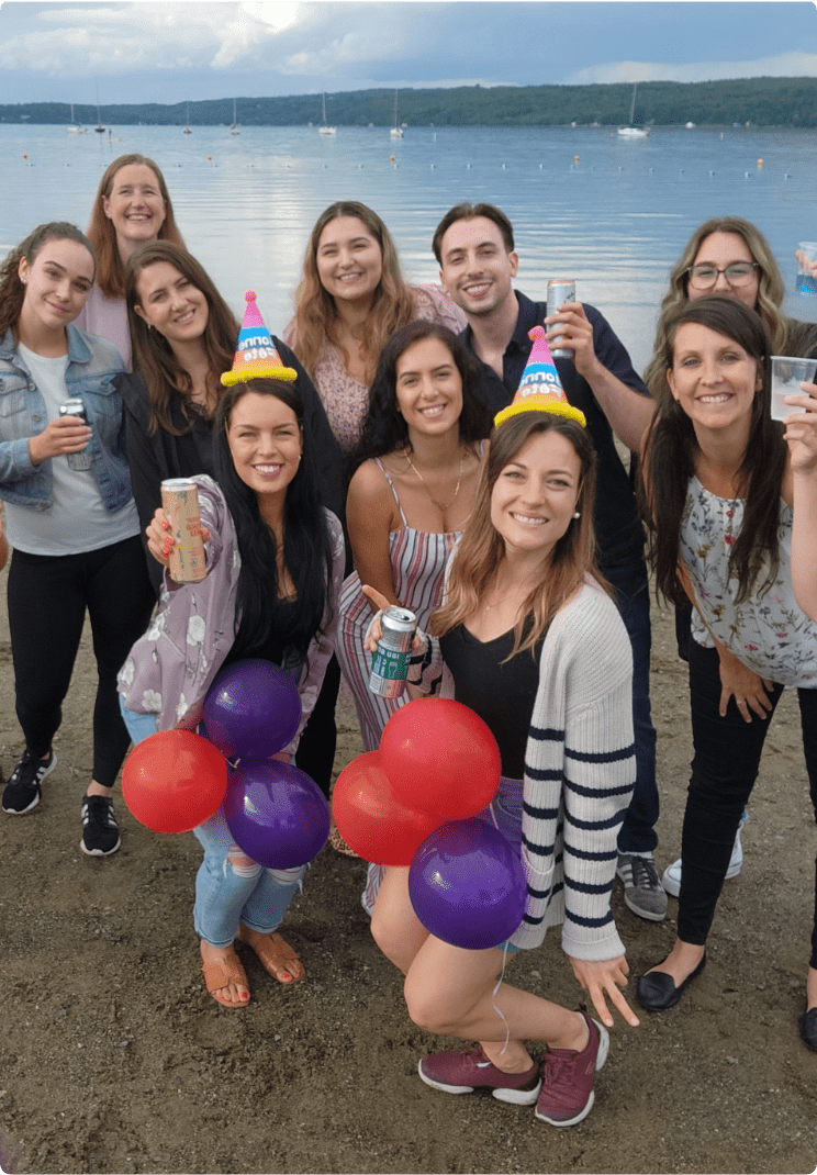 Lemieux Bédard employees on a beach smiling