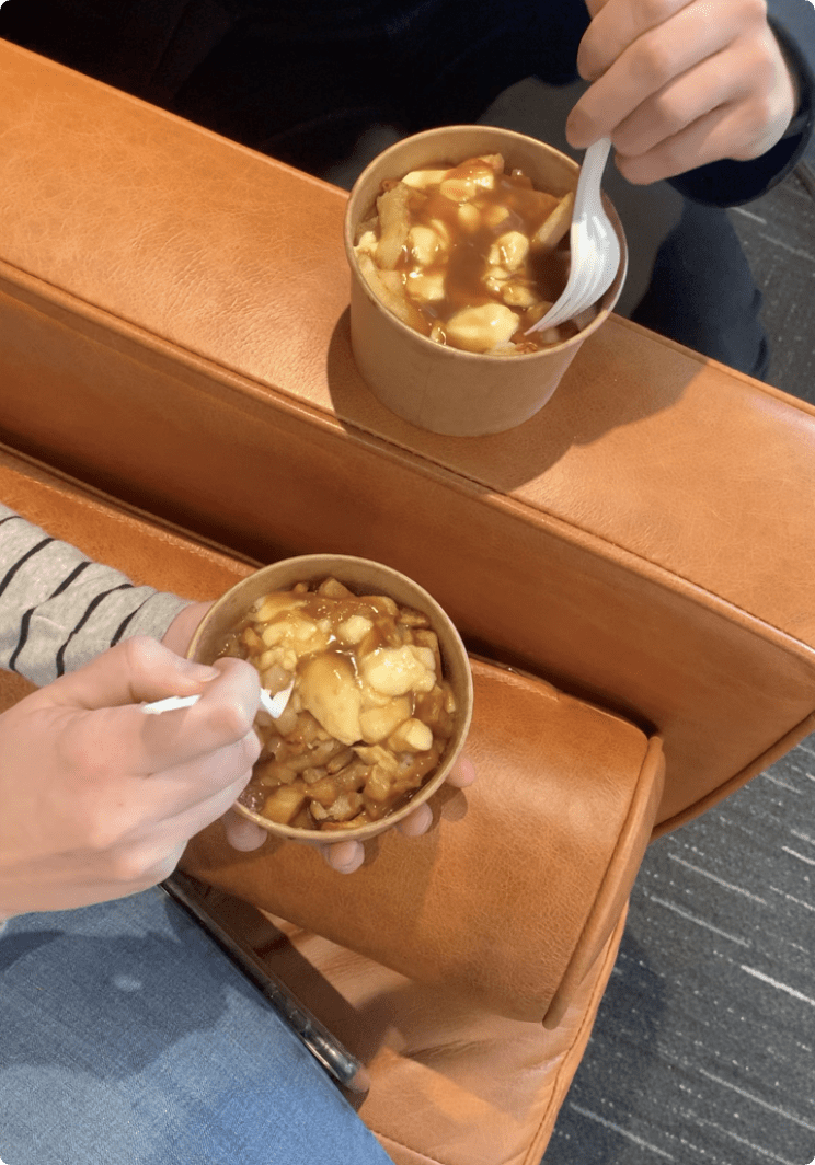 An employee eating a poutine