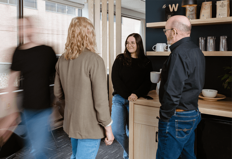 Lemieux Bédard employees smiling around the coffee machine